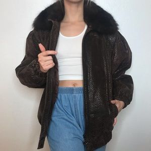 Leather coat with real fur collar